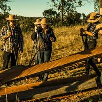 Participants carrying fencing posts to start building new fences