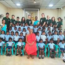 Volunteers with school students