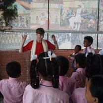 Performing the chicken dance with the children