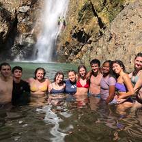 My group and I in front of a waterfall after a long hike.