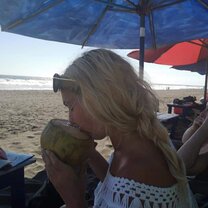 Me enjoying the coconut on one of our days off on the local beach 
