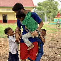 Playing games with children.