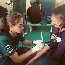 Taking blood pressure on a patient