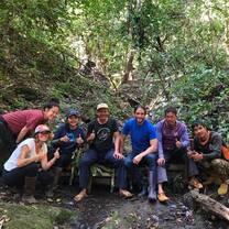 Us with the mahouts and other villagers, helping to build a dam. 