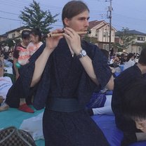 A picture of me in yukata playing a Japanese flute - shinobue.