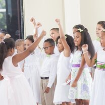 Young learners performing a song