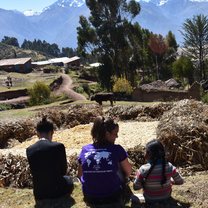 Aedan, a friend I met on the trip, and myself sitting with one of our host family's children overlooking the beautiful mountains of Peru.