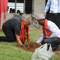 Planting a tree as part of the consveration programme  George planting a tree