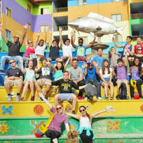 large group posing on colorful steps