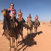 Students exploring the Wadi Rum desert by camel