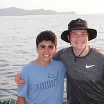 This is a photo of a friend and I on a huge boat that we were on in the ocean
