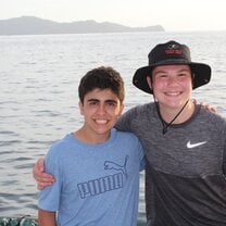 This is a photo of a friend and I on a huge boat that we were on in the ocean