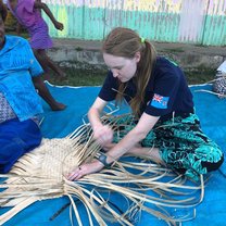 Zoe is weaving a traditional Fijian mat while Mere supervises