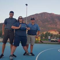 My friends and I playing basketball in Greece with a wonderful backdrop.