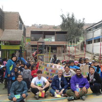 Volunteer team with children from the community