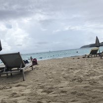 beach chair on the sand in front of the ocean