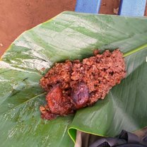 This delicious breakfast of black-eyed peas, rice, and deep-fried pieces of ripe plantain is a common breakfast and easy to get as street food. Here, it has been wrapped in a large waxy leaf for easy eating on the go. 