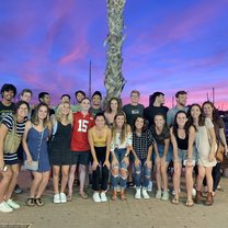 A group photo of the CIEE Alicante students at the pier one night