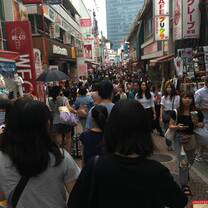 A photo of Harajuku street which was packed with people making it hard to walk through.