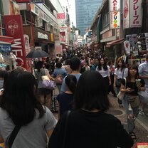 A photo of Harajuku street which was packed with people making it hard to walk through.