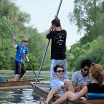 Students on a boat ride on the river Thames