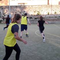 Students playing soccer with locals