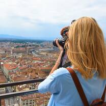 student taking photo from top of Duomo