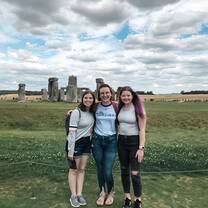 me and two friends outside of Stonehenge