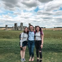 me and two friends outside of Stonehenge
