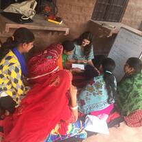 This picture shows me with my English advanced class, the Sunflower group. We often read English moral stories together.