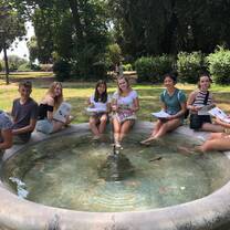 students studying in a fountain