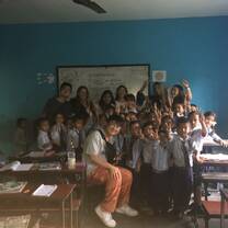 Teaching school children how to brush their teeth 