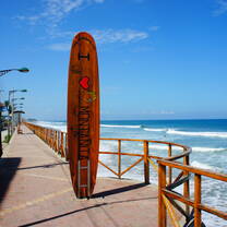 Learn to surf on one of South America's best beaches! 