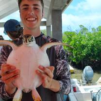 This is me when we were researching sea turtles one day. we actually got to catch them and tag them.