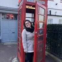 The typical photo in the iconic red telephone booth.