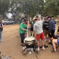 Learning to cook Pap, South Africa`s staple food