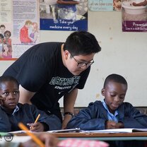 Assisting children in class Assisting children in class