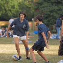 High school teens playing soccer in England.