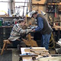 2019 Semester Program students use a shaving horse to craft stools from green ash wood.