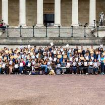 UCL Summer School students pose in front of UCL's Main Quad on the last day of the programme