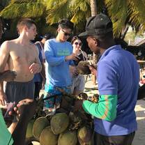 3 students are at the beach are grabbing a snack to eat