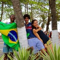 Students hold a Brazilian flag