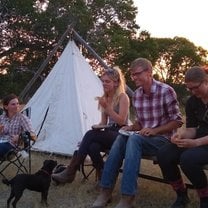 Lovely picture of our group kicking back by the fire at the nearby campsite after a day's ride