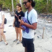 Course Coordinator holding turtle