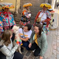My friends and I fawning over an adorable baby alpaca in the Cusco Plaza de Armas!