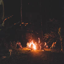 A nightly bonfire surrounded by interns at Hoja Nueva. 