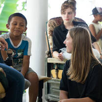 Volunteers chatting with local students