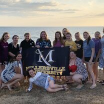 MU students at a volcanic sand beach