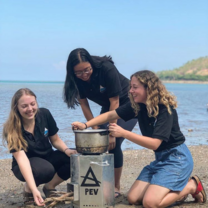 Engineering team testing their rocket stove
