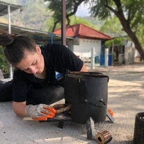 Trekker working on engineering stove